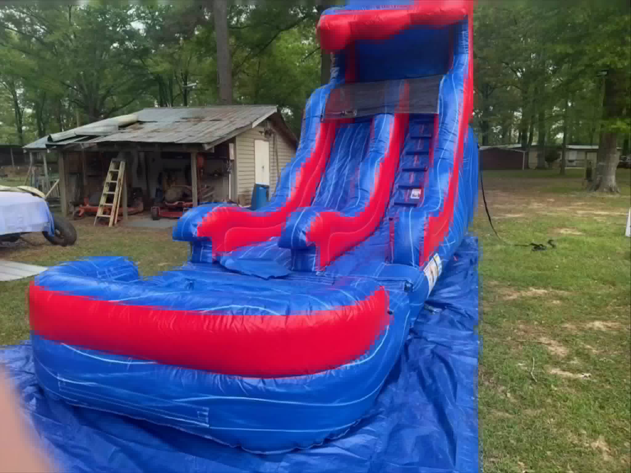 Red and blue inflatable water slide